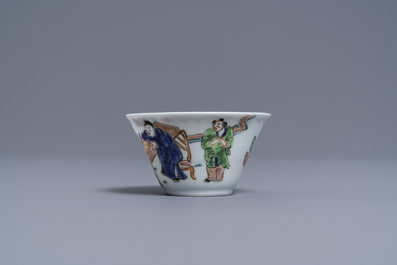 A Chinese famille rose 'tea scene' cup and saucer, Yongzheng/Qianlong