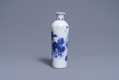 A Chinese blue and white rouleau vase with a figure in a landscape, Transitional period