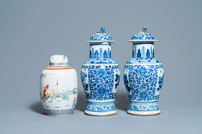 A pair of Chinese blue and white vases and a famille rose jar and cover, 19/20th C.