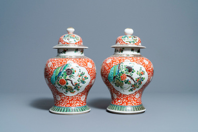 A pair of Chinese famille verte vases and covers, 19/20th C.