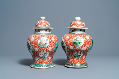 A pair of Chinese famille verte vases and covers, 19/20th C.