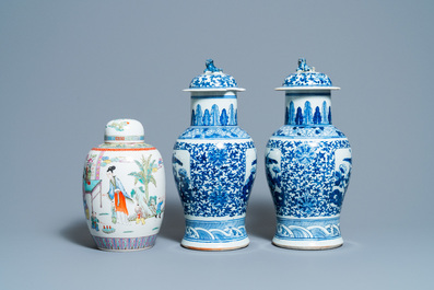 A pair of Chinese blue and white vases and a famille rose jar and cover, 19/20th C.