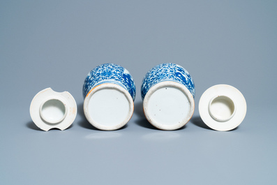 A pair of Chinese blue and white vases and a famille rose jar and cover, 19/20th C.