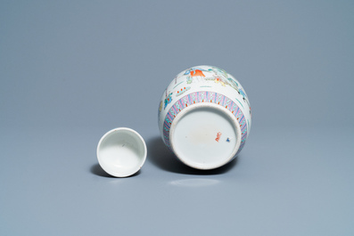 A pair of Chinese blue and white vases and a famille rose jar and cover, 19/20th C.