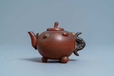 A Chinese Yixing stoneware teapot and cover with applied nuts, 19/20th C.