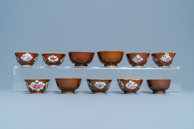 31 Chinese capucine brown-ground saucers and 22 cups, Kangxi/Qianlong