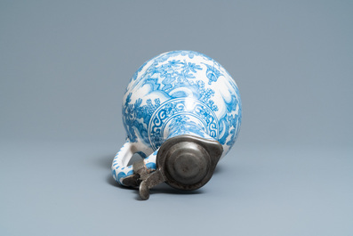 A large Dutch Delft blue and white chinoiserie jug with pewter cover, 17th C.