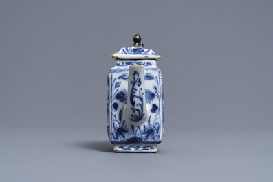A rare Dutch Delft blue and white relief-moulded teapot and cover, late 17th C.