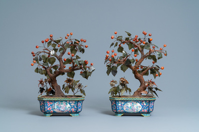 A pair of large Chinese Canton enamel jardini&egrave;res with jade and hardstone trees, 19th C.