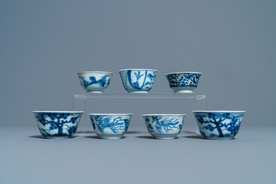 Eighteen Chinese blue and white saucers, seven cups, two dishes and a tea caddy, Kangxi/Qianlong