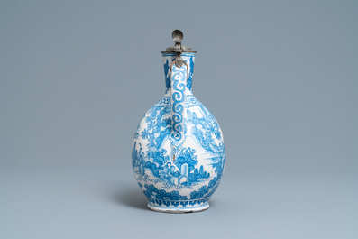 A large Dutch Delft blue and white chinoiserie jug with pewter cover, 17th C.