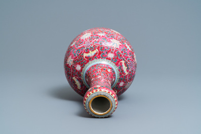 A Chinese famille rose ruby-ground bottle vase, Qianlong mark, 19/20th C.