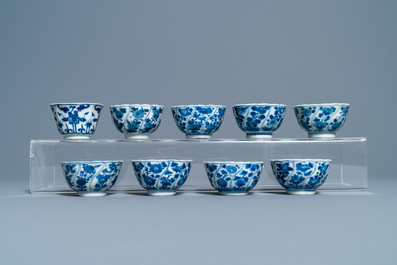 A collection of Chinese and Japanese blue and white cups and saucers and two ewers, Wanli and later