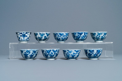 A collection of Chinese and Japanese blue and white cups and saucers and two ewers, Wanli and later