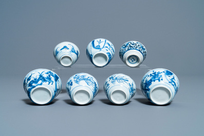 Eighteen Chinese blue and white saucers, seven cups, two dishes and a tea caddy, Kangxi/Qianlong