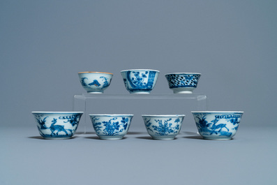 Eighteen Chinese blue and white saucers, seven cups, two dishes and a tea caddy, Kangxi/Qianlong