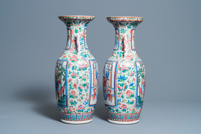 A pair of Chinese famille rose 'court scene' vases, 19th C.