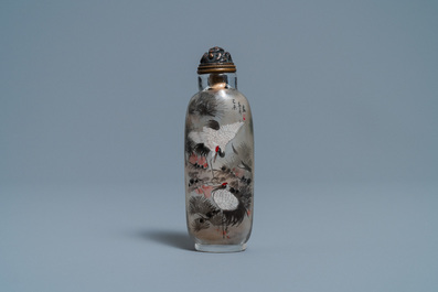 A Chinese inside-painted glass snuff bottle with cranes, signed Ding Erzhong, dated 1895