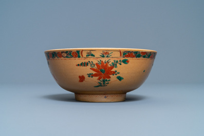 A Chinese capucine brown-ground famille verte plate and a bowl, Kangxi