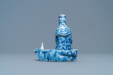 A Chinese blue and white figure of a seated Guanyin, 19th C.