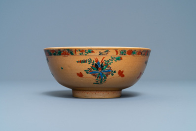 A Chinese capucine brown-ground famille verte plate and a bowl, Kangxi