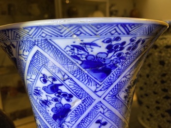A large Chinese blue and white five-piece garniture with floral and landscape panels, Kangxi