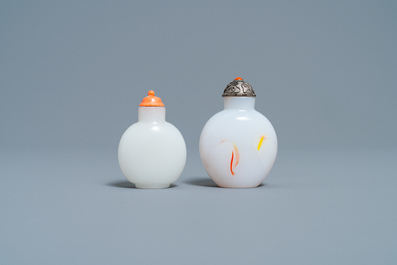 A Chinese white jade coral-topped snuff bottle and one in glass with inclusions, 19th C.