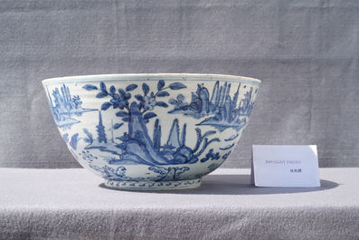 A large Chinese blue and white 'river landscape' bowl, Ming