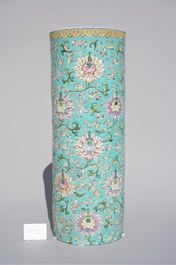 A large Chinese famille rose cylindrical vase with molded lotus scrolls, Jiaqing/Daoguang