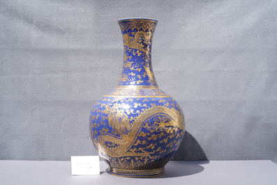 A large Chinese monochrome blue gilt-decorated 'dragon and phoenix' bottle vase, Guangxu mark and of the period