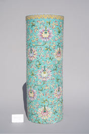 A large Chinese famille rose cylindrical vase with molded lotus scrolls, Jiaqing/Daoguang