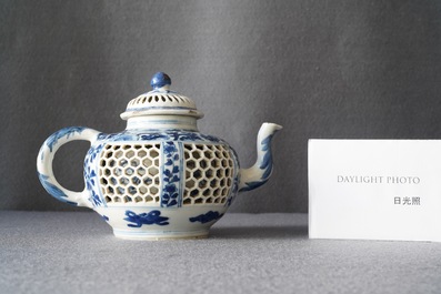 A Chinese blue and white reticulated double-walled teapot and cover, Transitional period