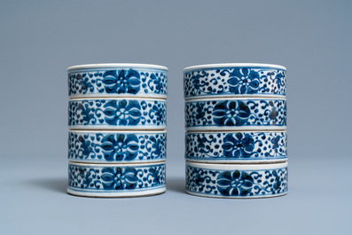A pair of Chinese blue and white three-tier stacking boxes, a seal paste box and four saucers, 19th C.