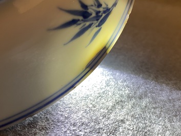 A Chinese blue, white and copper-red saucer dish with floral design, Kangxi