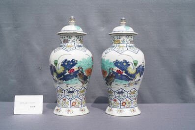 A pair of Chinese famille rose 'mandarin ducks' vases and covers, Kangxi mark, Republic