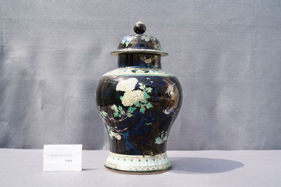 A Chinese famille noire vase and cover, 19th C.