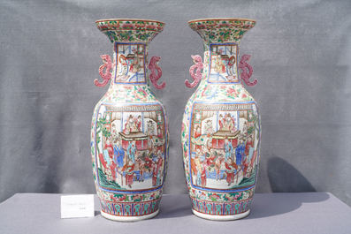 A pair of Chinese famille rose 'court scene' vases, 19th C.