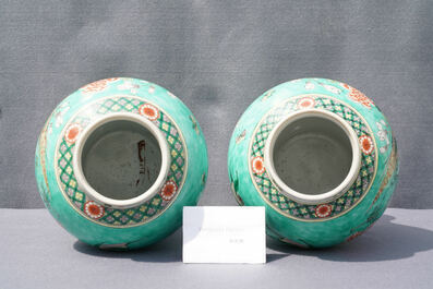 A pair of Chinese turquoise-ground famille verte vases and covers, 19th C.