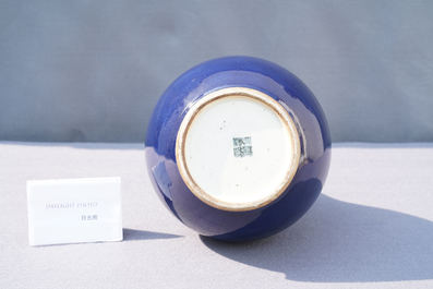 A Chinese monochrome 'sacrificial blue' bottle vase, Qianlong mark and of the period