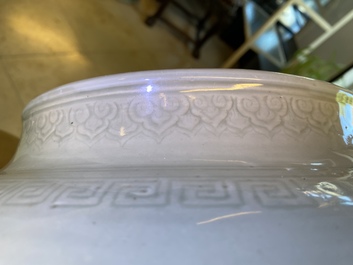 A globular Chinese monochrome celadon 'dragon' vase, Kangxi