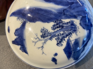 A Chinese blue and white jar and cover with figures in a landscape, Transitional period