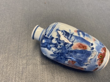 A small Chinese blue, white and copper-red vase, 19th C.