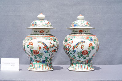 Two pairs of Chinese blue and white and famille verte vases and covers, 19/20th C.