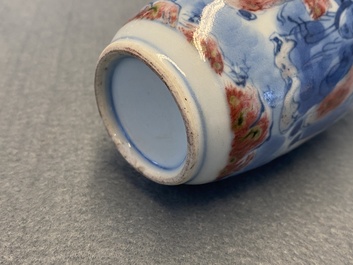 A small Chinese blue, white and copper-red vase, 19th C.