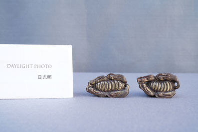 Two Chinese gilt and lacquered bronze 'mythical beast' scroll weights, late Ming