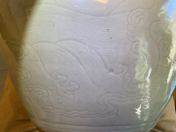 A globular Chinese monochrome celadon 'dragon' vase, Kangxi