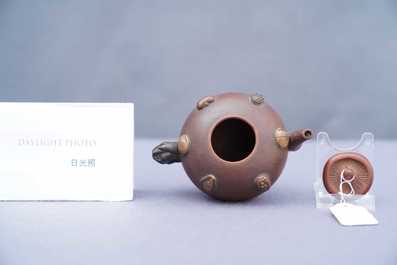 A Chinese Yixing stoneware teapot and cover with applied nuts, 19/20th C.