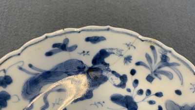 A collection of Chinese and Japanese blue and white cups and saucers and two ewers, Wanli and later