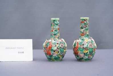 A pair of Chinese reticulated famille verte bottle vases, 19th C.