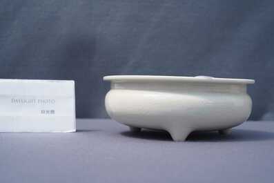 A Chinese Dehua blanc de Chine tripod censer with an incised design, Kangxi